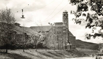 1930 photograph of Memorial Gymnasium. View of power transformers on the wires. Donor: Virginia R. Vanderhoff.