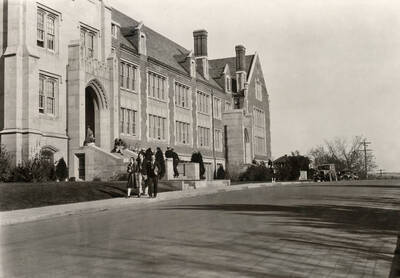 1930 photograph of Science Hall Renamed Life Sciences Building in 1964. View of students walking to class.