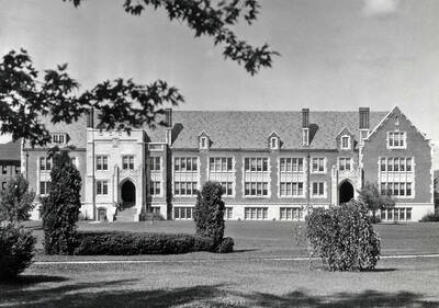 1936 photograph of Science Hall Renamed Life Sciences Building. View of student at entrance.