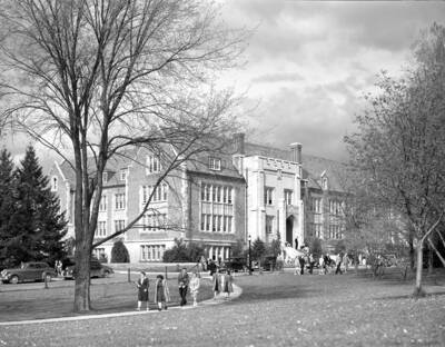 1940 photograph of Science Hall Renamed Life Sciences Building in 1964. View of students walking to class.
