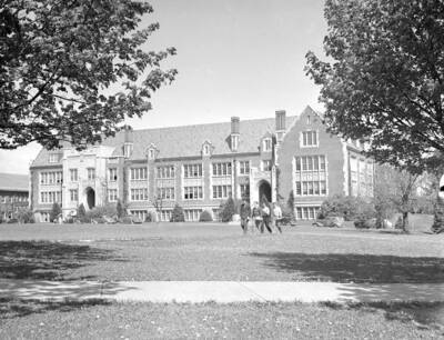 1935 photograph of Science Hall Renamed Life Sciences Building in 1964. View of students walking to class.