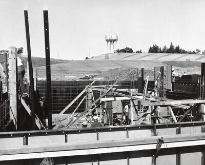 1958 photograph of Campus Club. View of construction with the water tower in the background.