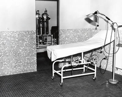 1960 photograph of Infirmary. View of the examination room. Donor: Publications Dept.