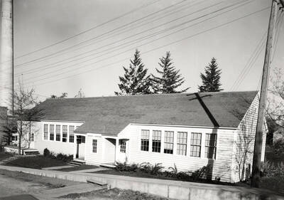 1936 photograph of Forestry Laboratory. Power plant stack is visible on the left.