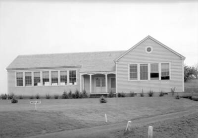 1935 photograph of Industrial Arts Building. 'Keep Off' signs on the new lawn.
