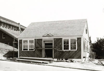 1935 photograph of University Classroom Building. View of construction debris.