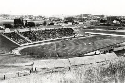 1939 photograph of Neale Stadium. View shows the grandstands full of fans at the football game. Donor: Publications Dept.