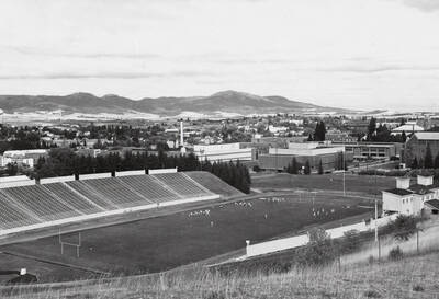1960 photograph of Neale Stadium. View of football practice.