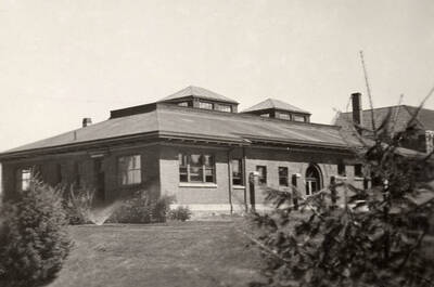 1923 photograph of Geology Building. View of the landscaping around the building.