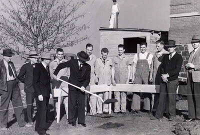 1941-10-22 photograph of Dairy Science Building l-r: William Davidson, Dr. Theophilus, Dean Iddings, student, President Dale, William Thomas, William Lind.