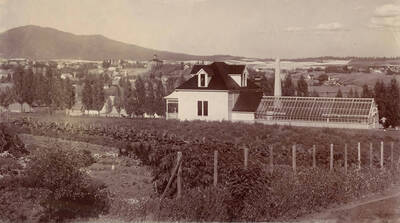 1900 photograph of Horticulture Building. View of Moscow Mountain in the background on the left. Donor: W.C. Edmundson.