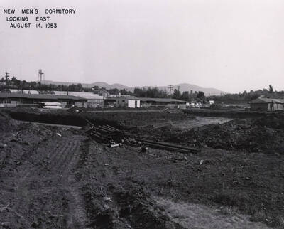 August 14, 1953 photograph of Gault Hall under construction. Water tower in background.