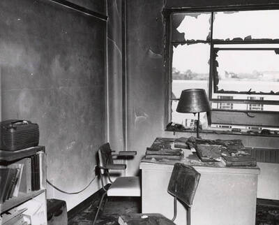 1956 photograph of Gault Hall. Interior of a study room after a fire.
