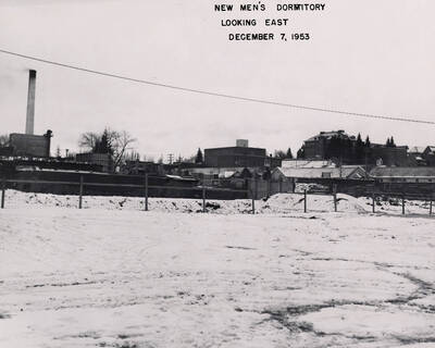 December 7, 1953 photograph of Gault Hall under construction. Snow covers the scene.