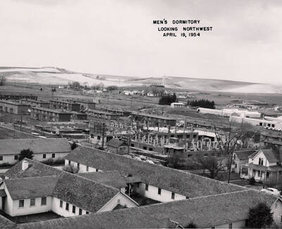 April 19, 1954 photograph of Gault Hall under construction. Water Tower in the background.
