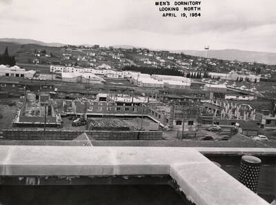 April 19, 1954 photograph of Gault Hall under construction. Water Tower in the background.