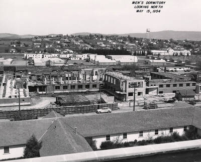 May 15, 1954 photograph of Gault Hall under construction. Water Tower in the background.
