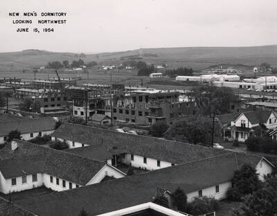 June 15, 1954 photograph of Gault Hall under construction. Water tower in the background.