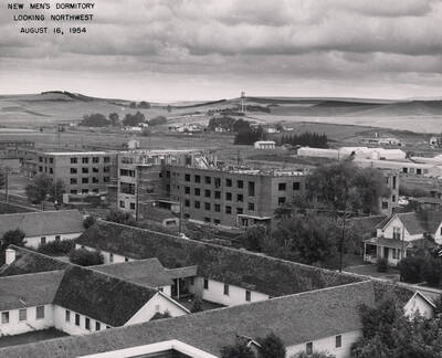 August 16, 1954 photograph of Gault Hall under construction. Water tower in the background.