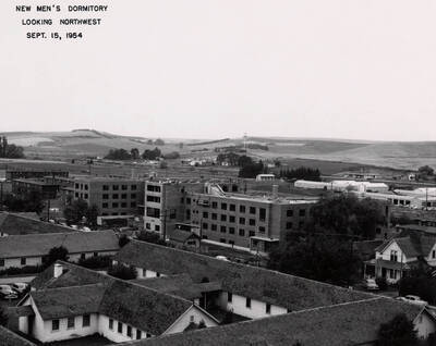 September 15, 1954 photograph of Gault Hall under construction. Water Tower in the background.