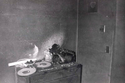 1956 photograph of Gault Hall. Interior photograph of a student room after a fire. Donor: Maurice Johnson.