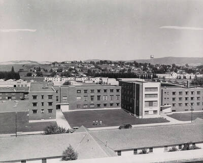 1955 photograph of Gault Hall. Water Tower in the background.