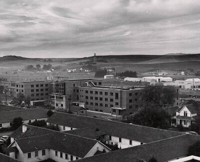 1954 photograph of Gault Hall under construction. Water Tower in the background. Donor: Publications Dept.