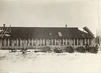 1924 photograph of the Engineering laboratories. Snow covers the scene.