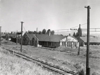 1936 photograph of the Engineering laboratories. Railroad tracks in the foreground.