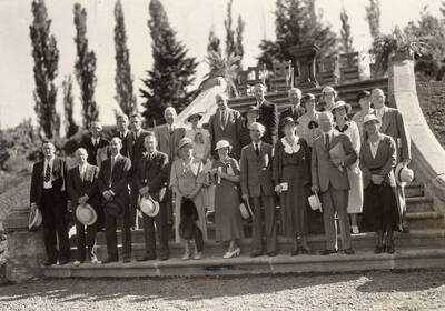 June 1, 1934 photograph of alumni and faculty standing on Memorial Steps. Trees in background.