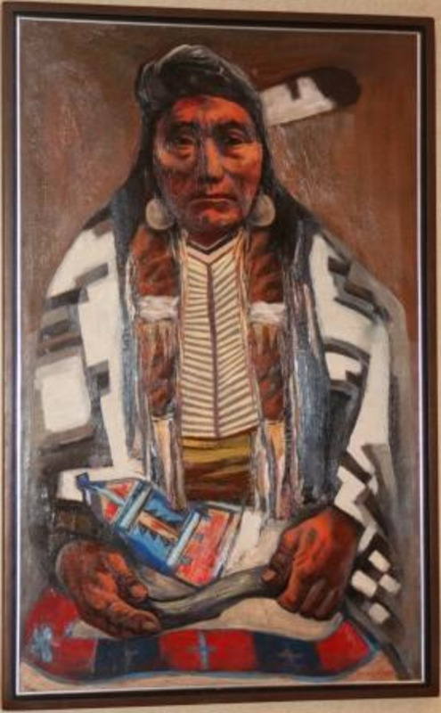 Portrait painting of Chief Joseph displayed in a wood frame with silver gilt inner trim. Painting is signed by artist.