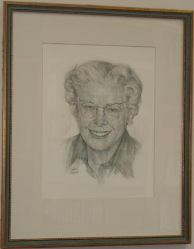 Portrait drawing of Grace Martin done in graphite. The drawing is matted and framed in a thin gilt wood frame.