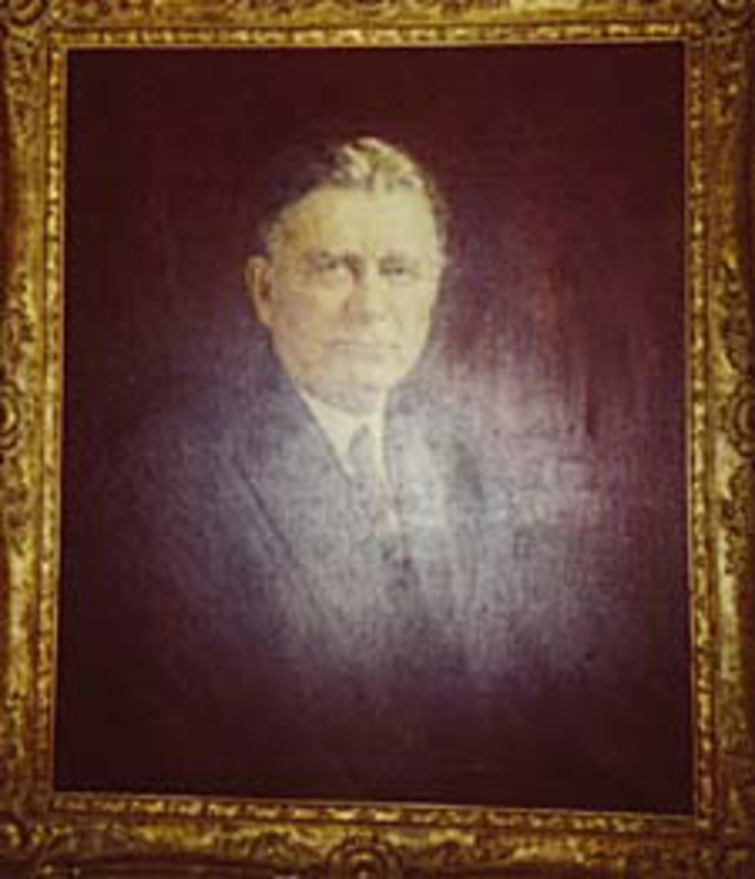 Portrait painting of Senator William Edgar Borah displayed in a gold leaf frame.
