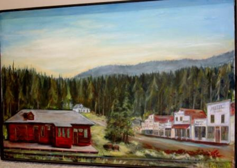 Painting depicting red and white buildings on the foreground against a background of trees and mountain.