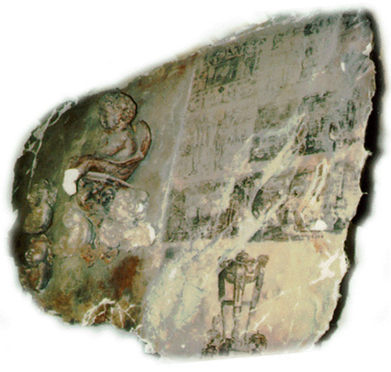 A brown toned wall fragment of a sculpture depicting putti.