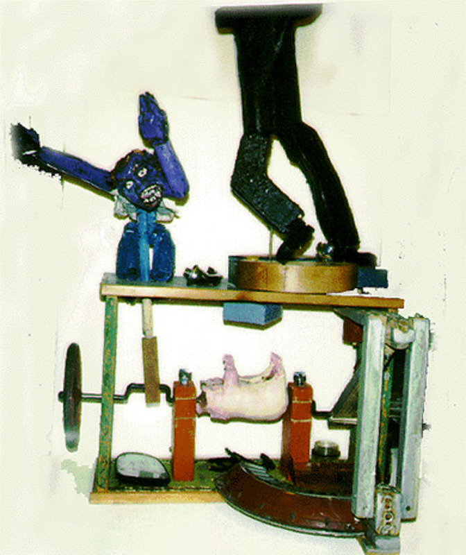 Mixed media assemblage sculpture with various figures that move and raise as the wheel is turned. The pieces include a blue man, a pair of black legs and a pink pig.