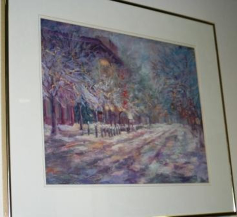 Pastel drawing of a snow-covered road on the U of I campus in purples, blues, whites, and reds. It is displayed in a gold frame.