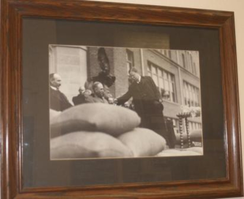 Black and white photograph of President Teddy Roosevelt and James MacLean, president of the University of Idaho 1900-1913. Displayed under glass in a wooden frame.