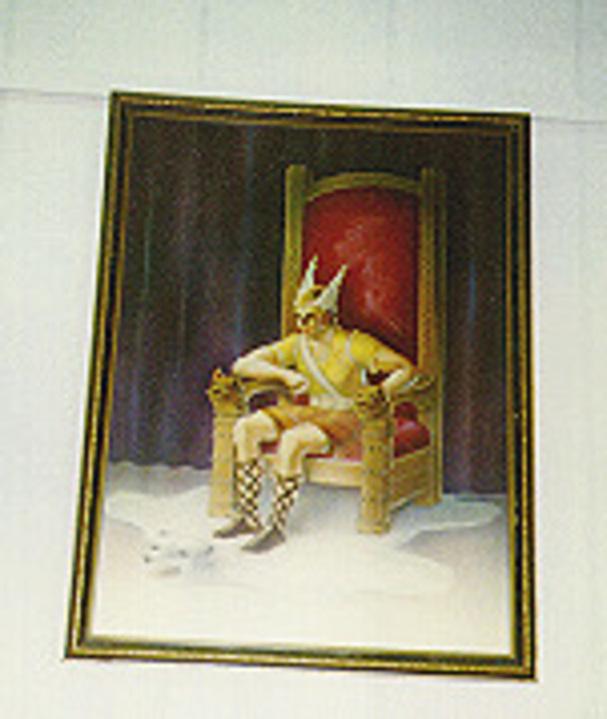 Painting depicting a yellow clad figure wearing a winged helm sitting in a cushioned throne. Displayed in a thin wooden frame.