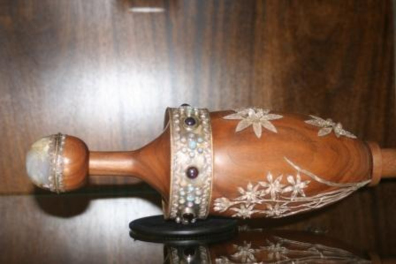 Wooden mace made from walnut decorated with silver, gold, opals, and garnets designed by Edmund Chavez.