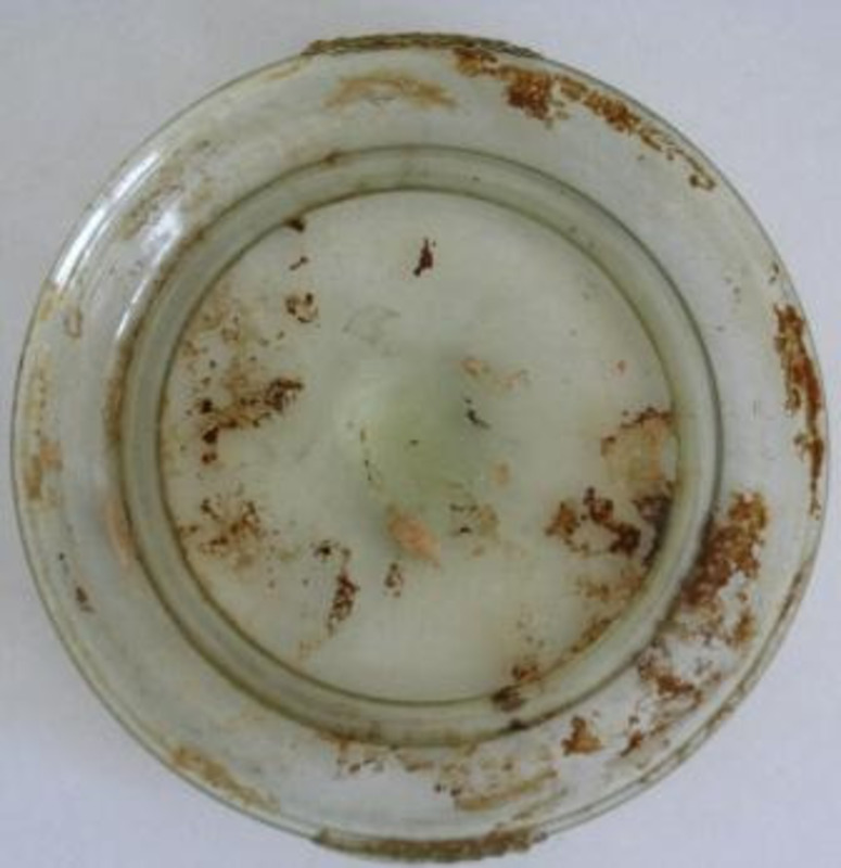 Glass plate covered with dirt and debris.
