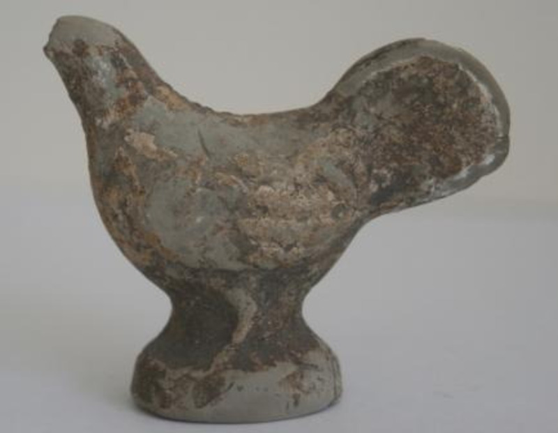 Terracotta sculpture depicting a chicken.