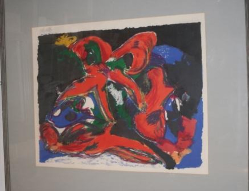 Print showing abstract forms in shades of red, green, yellow, blue, black, and white. Displayed using a gray mate in a gray wooden frame.