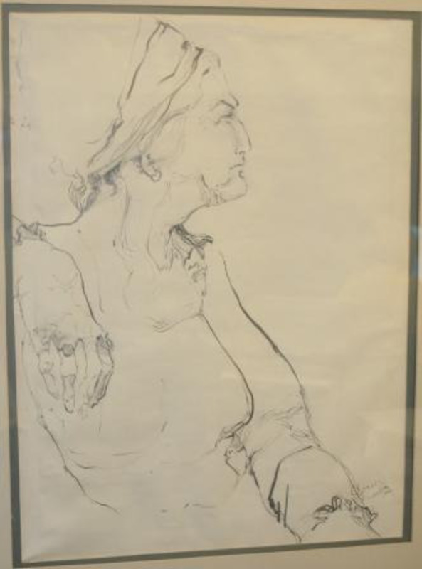 Graphite drawing showing the profile of a woman. Displayed using blue and white mattes in a black wooden frame.