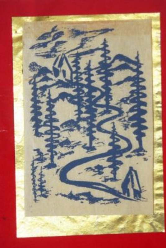 Silkscreen of a path between two houses in a forested landscape printed with blue ink on a greeting card mounted on red paper with gold foil