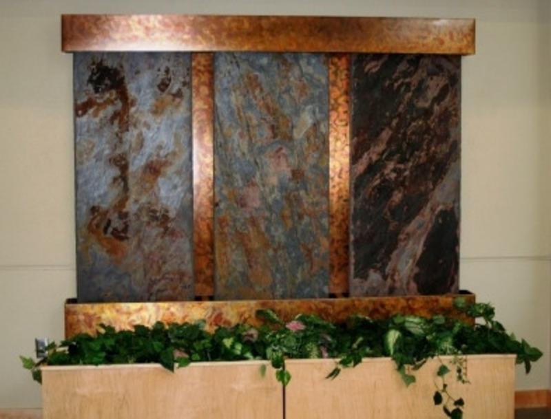 Waterfall sculpture made from copper and stone.