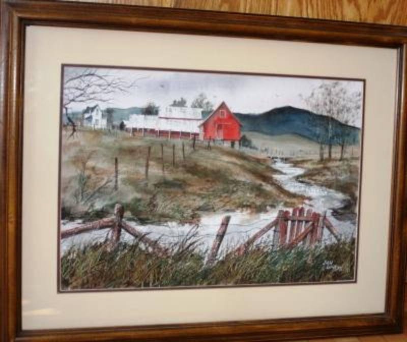 Painting depicting a stream flowing through farmland with with a red barn and a white farmhouse. Displayed using a brown trimmed cream matte in a wooden frame.
