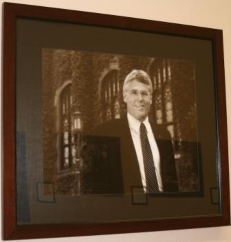 Black and white photograph of Steven B. Daley-Laursen, interim President of the University of Idaho 2008-2009. The photograph is displayed with a black matte in a wooden frame.