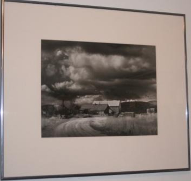 Photograph of dark clouds above the Hill City Elevators using a cream matt in a silver frame.