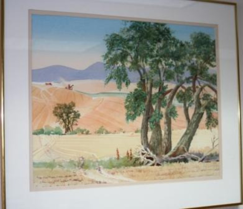 Painting of a Palouse landscape featuring trees in the foreground with a tractor and hay truck harvesting fields on the rolling hills in the background.